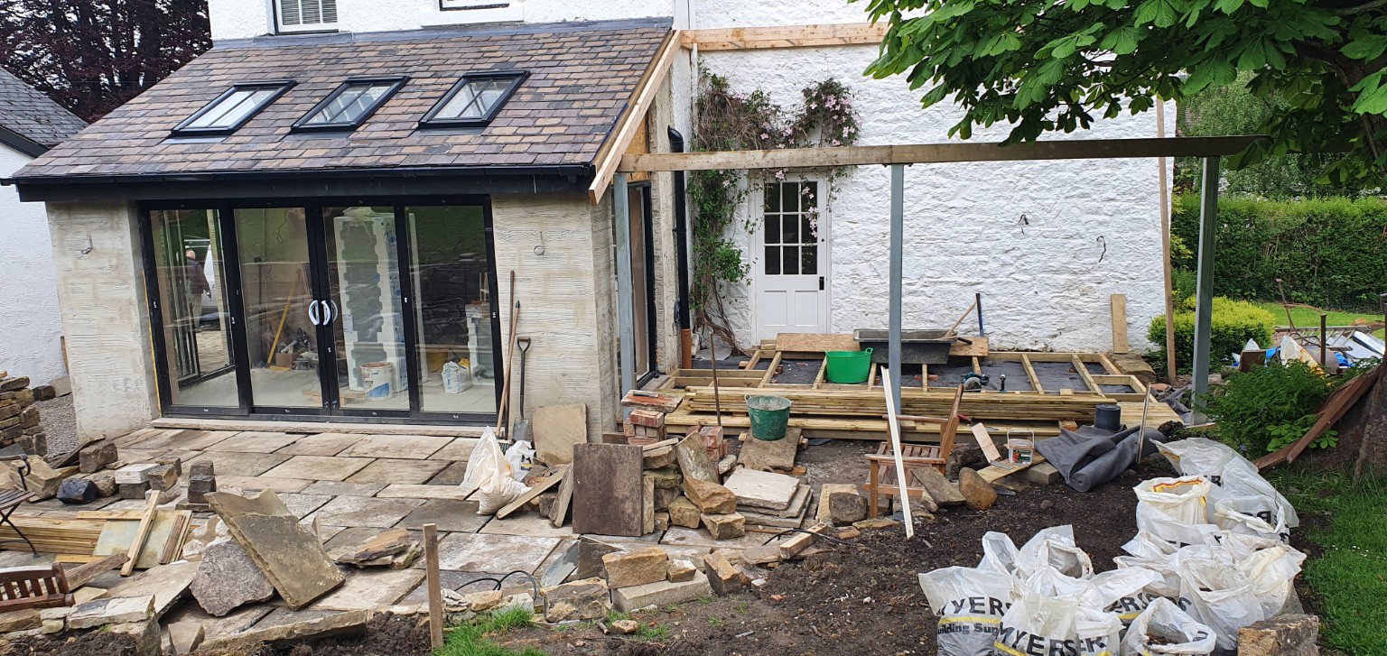 Glazed doors and adjoining covered area nearing completion