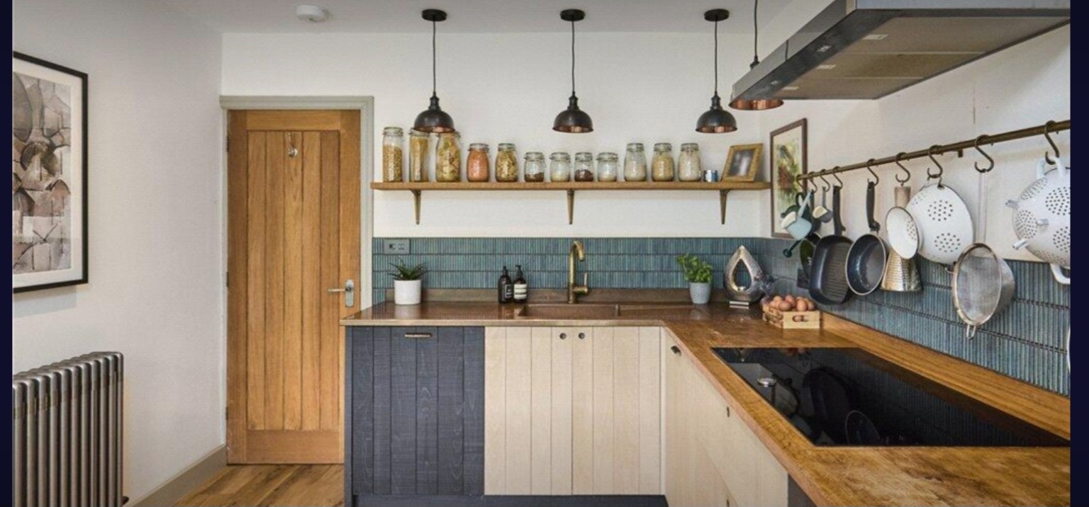 Detailed view of the bespoke two-tone kitchen with timber worktops